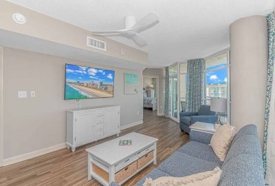 Relax in the large living space of our penthouse vacation rental at Dunes Village, Myrtle Beach. Enjoy ample room for family gatherings and stunning Resor and ocean views.