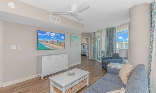 Relax in the large living space of our penthouse vacation rental at Dunes Village, Myrtle Beach. Enjoy ample room for family gatherings and stunning Resor and ocean views.