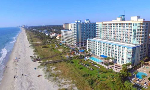 Immerse yourself in coastal beauty from the penthouse suite, Dunes Village Resort, with stunning ocean views