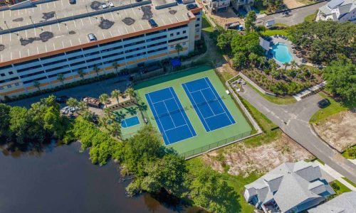 Pristine tennis courts and pickleball amenities available at the penthouse in Dunes Village
