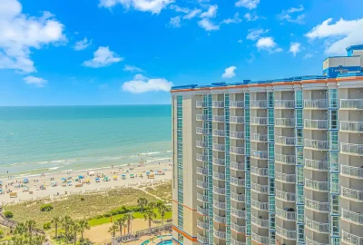 Penthouse suite at Dunes Village Resort with stunning ocean views and luxurious amenities, perfect for a family vacation, short-term rental.