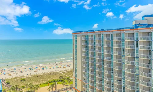 Penthouse suite at Dunes Village Resort with stunning ocean views and luxurious amenities, perfect for a family vacation, short-term rental.
