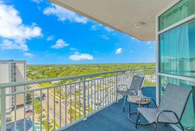 A penthouse inside Dunes Village with a wrap-around balcony overlooking the ocean and Myrtle Beach